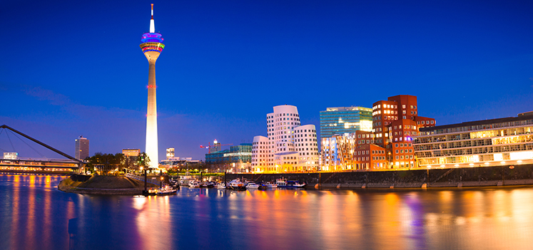 Colorful night scene of Rhein river at night in Dusseldorf. Photo: Getty Images/iStockphoto